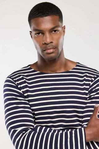 Man wearing navy and white striped long-sleeve shirt, casual nautical fashion