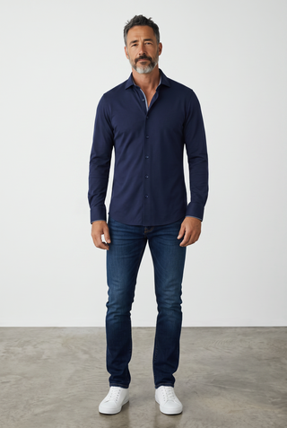 A man wearing a navy blue Emanuel Berg Byron long-sleeve shirt in 4Flex stretch fabric with a modern fit.