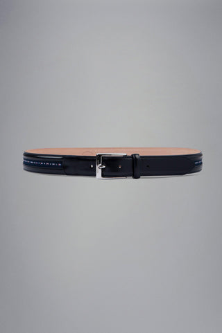 Black leather belt with silver buckle and nautical flag accents on grey background