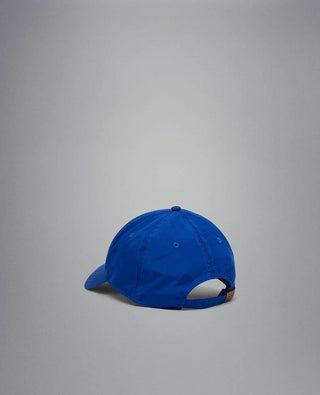 Blue nylon yachting cap with adjustable strap, back view on gray background