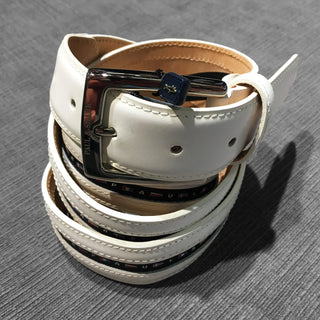 White leather belt with nautical flag accents and silver buckle on grey background
