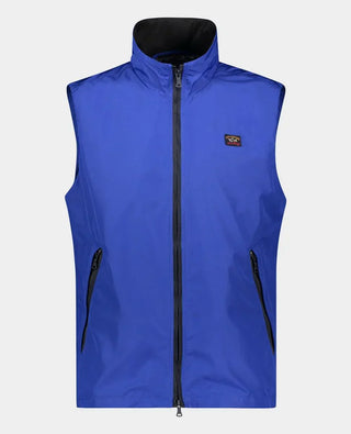 Men’s sleeveless blue nylon vest with zipper pockets and a small chest logo patch.